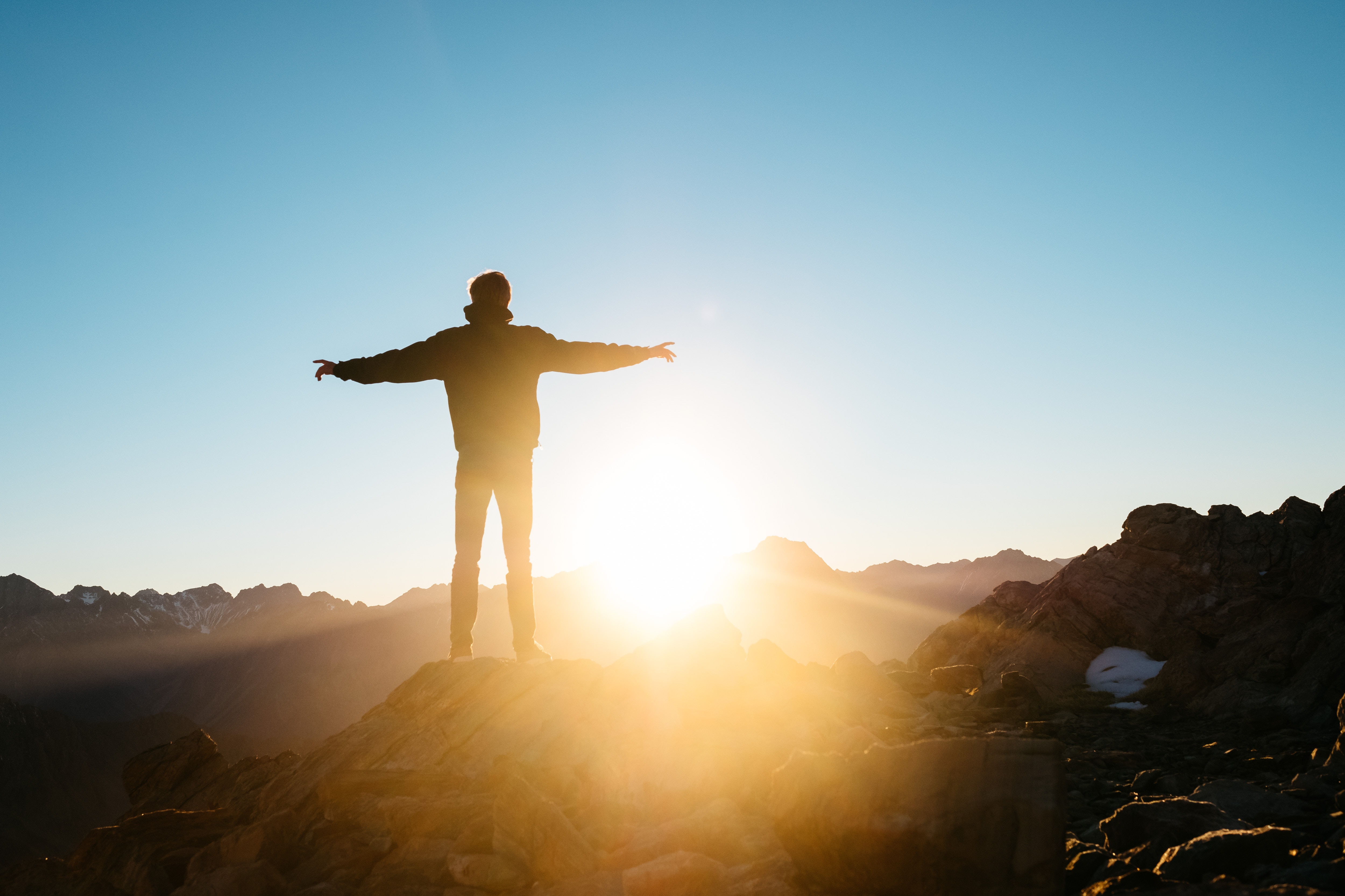 Man on Mountain w/ Outstretched Arms
